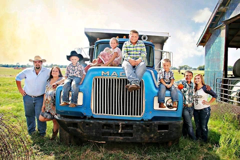Oklahoma family portrait beside a blue farm truck