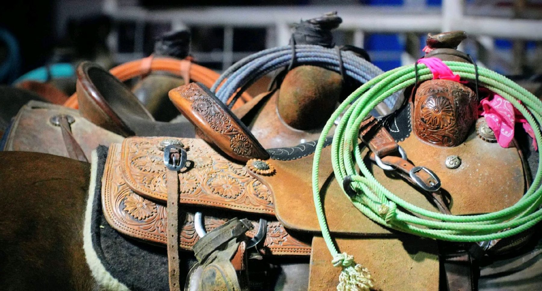 Hand-tooled western leather saddles — Oklahoma wedding heritage detail