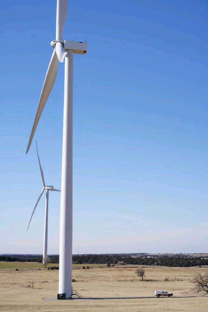 Wind turbines standing across an open Oklahoma landscape