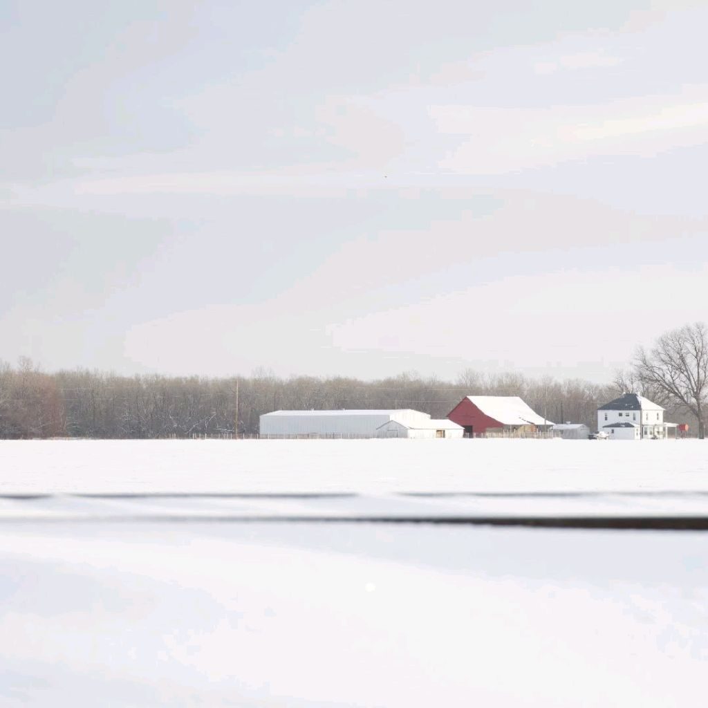 Snow-dusted Oklahoma barn in winter